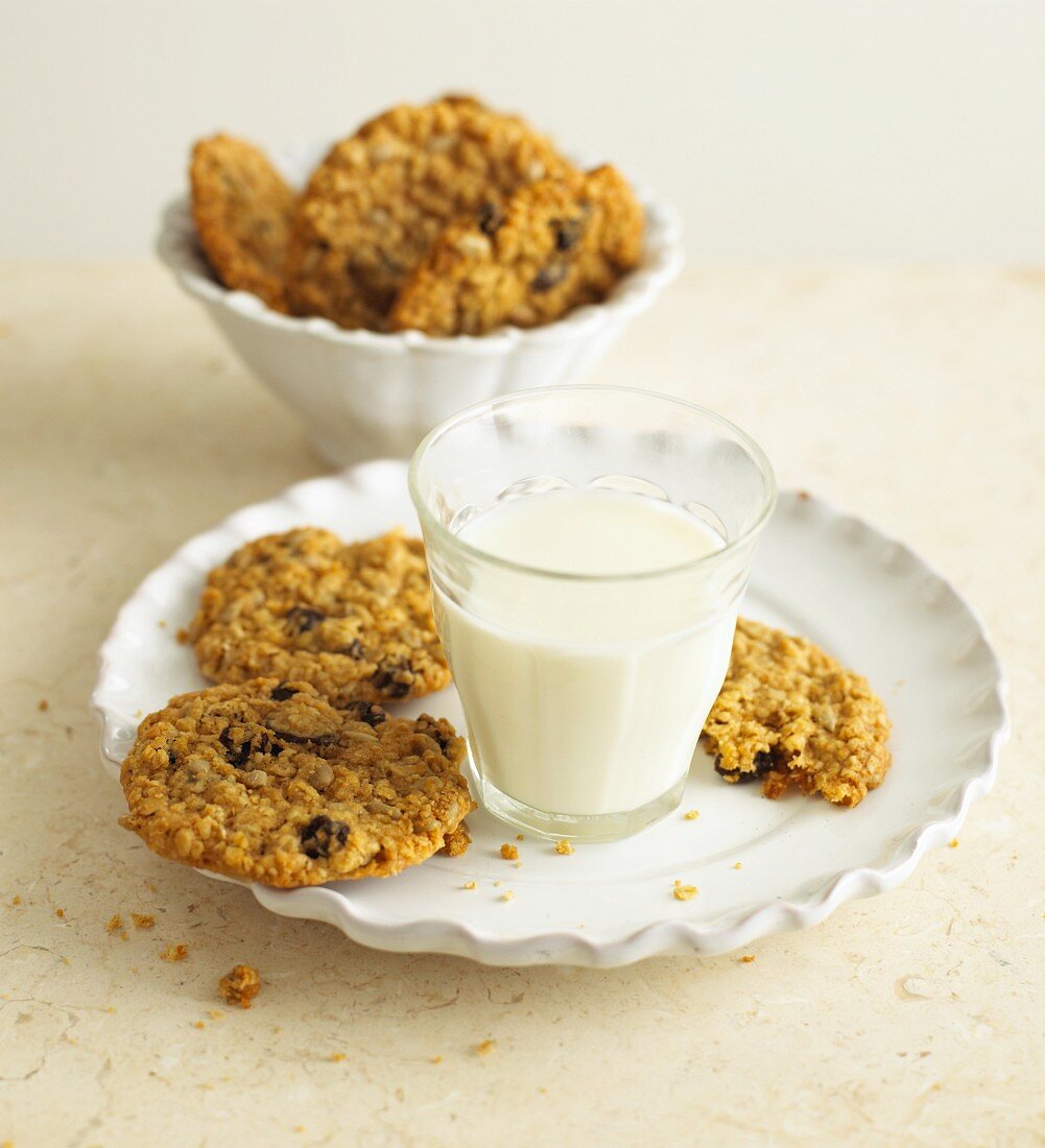 Oatmeal and raisin cookies and a glass of milk