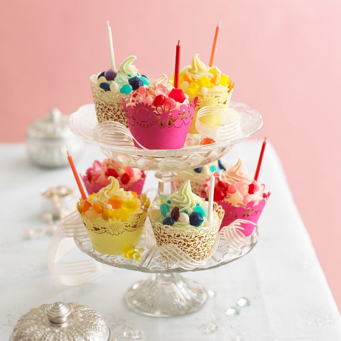 Various party cupcakes on a cake stand