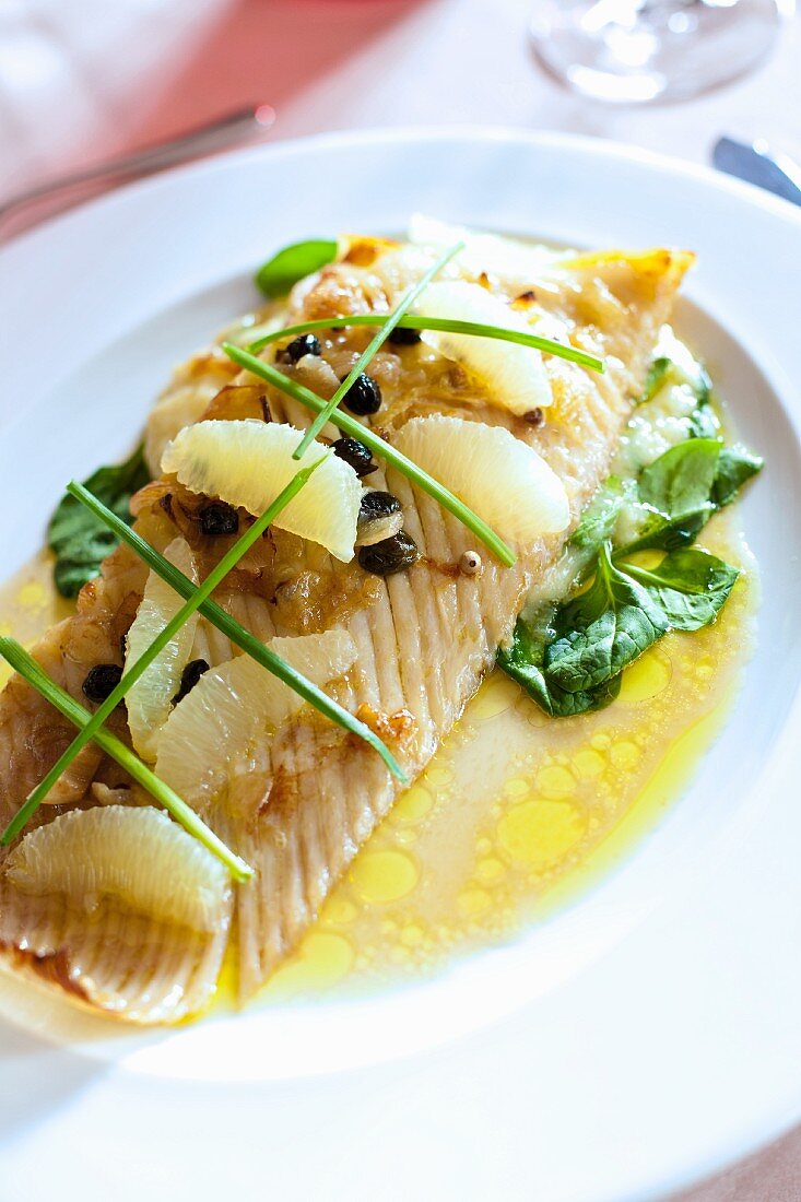 A ray wing with grapefruit, raisins and chives