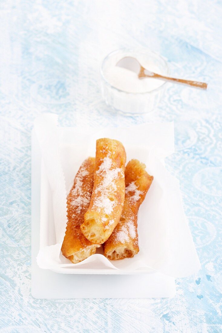 Porras (Spanish fritters) with icing sugar