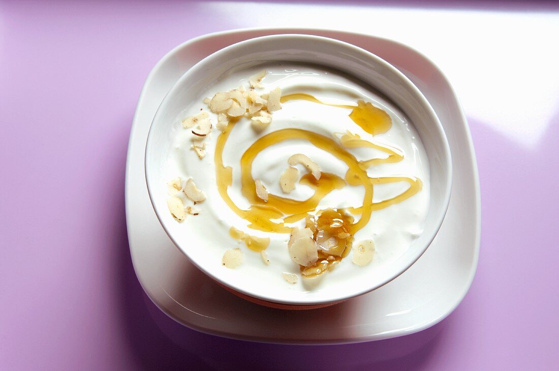 Yogurt with honey and grated hazelnuts