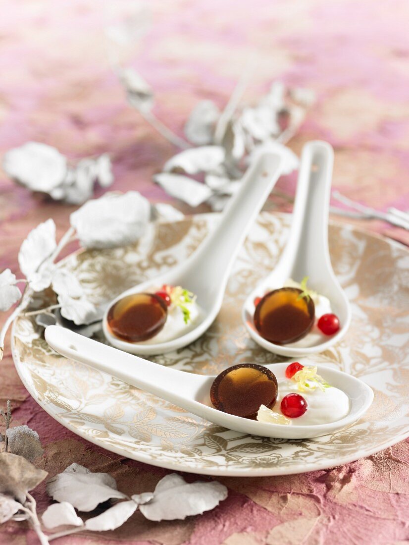 Caramellos with yogurt on spoons