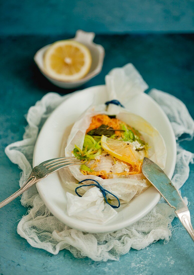 Fish fillets with vegetables in parchment paper