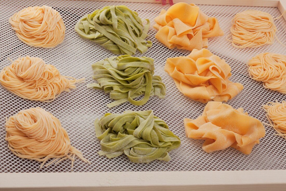 Pasta nests drying on a rack