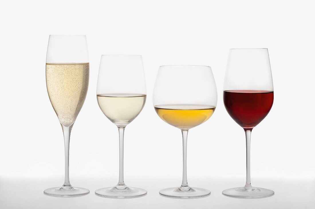 A champagne flute, a white wine glass, a Burgundy glass and a red wine glass