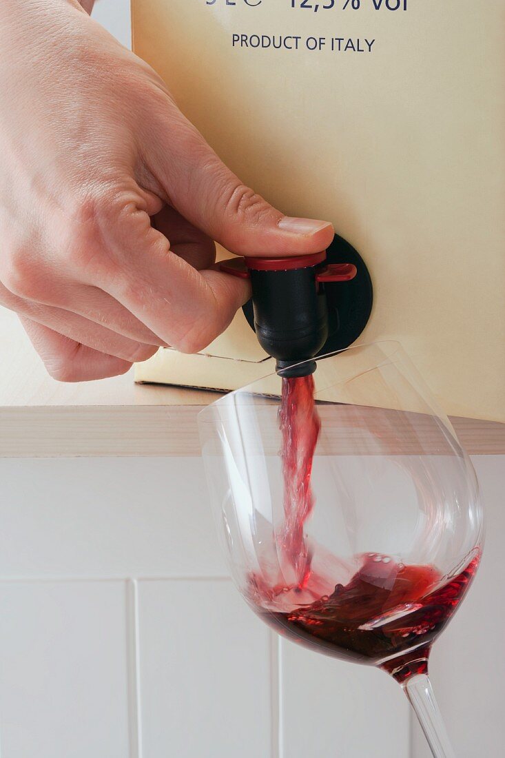 Red wine being poured from a bag-in-a-box
