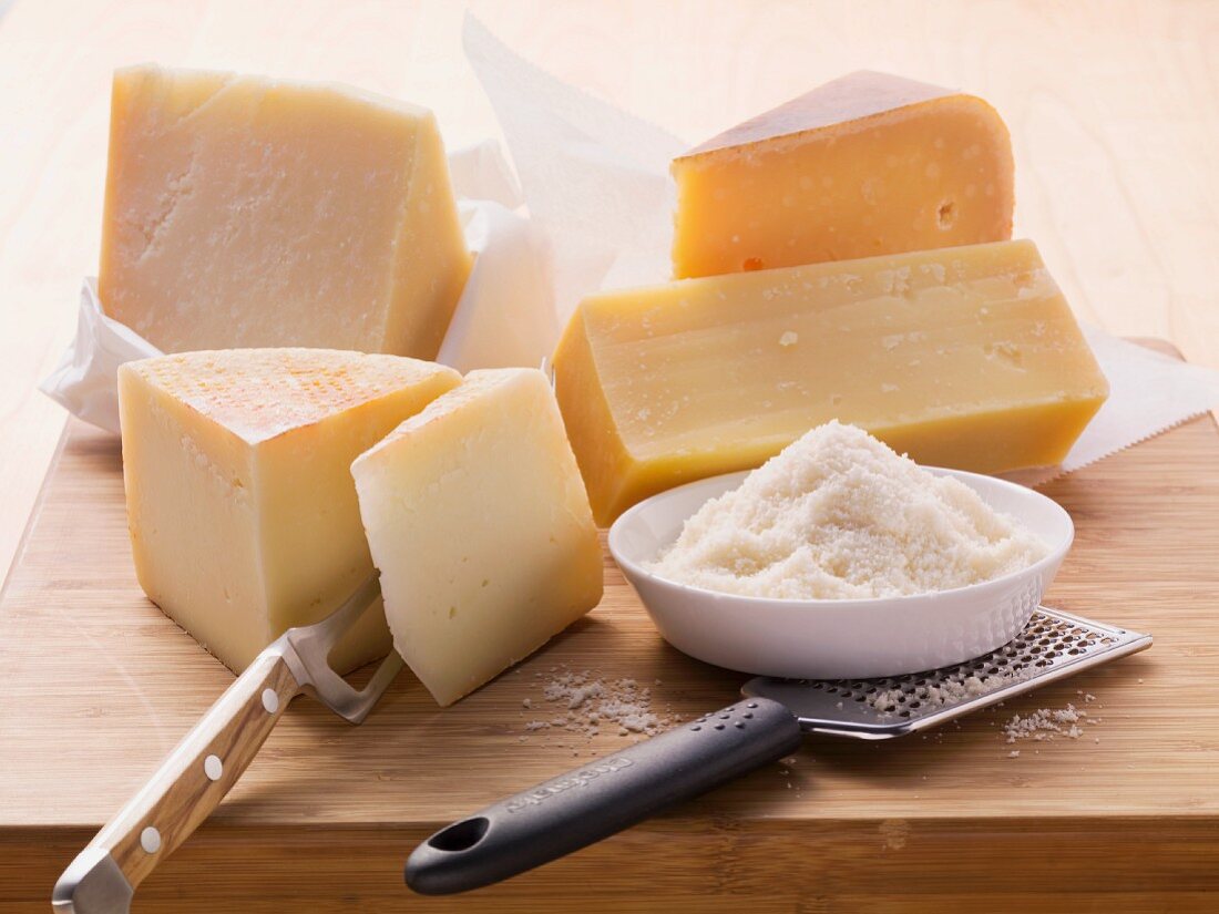 An arrangement of hard cheeses (Parmesan, Pecorino and Gouda)