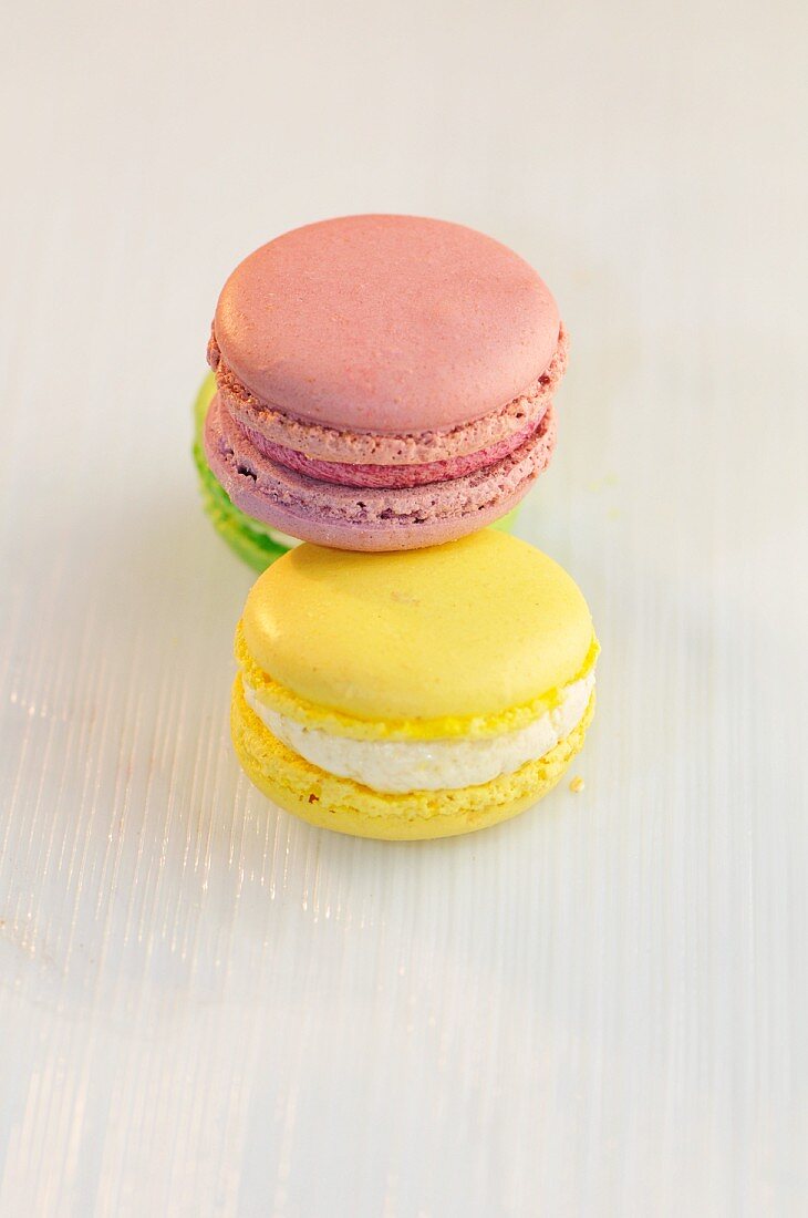 Three macaroons (green, pink, yellow)