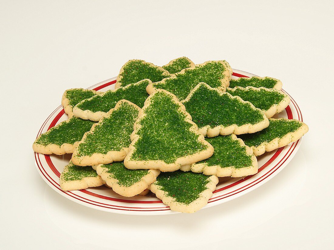 Christmas Sugar Cookies; Christmas Trees with Green Sugar Sprinkles on a Plate; White Background