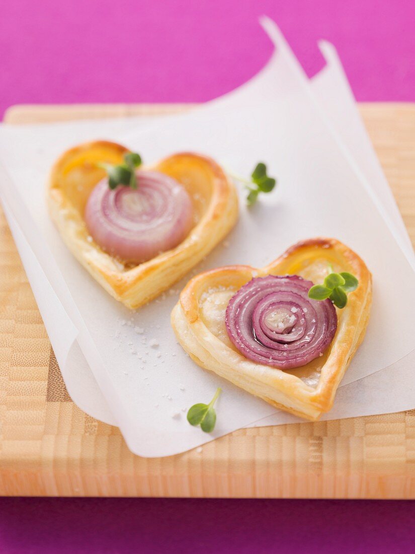 Heart-shaped puff pastry onion tartlets