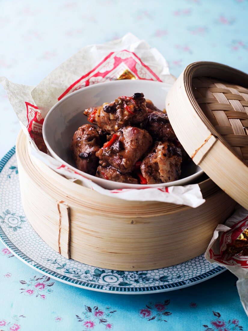 Spare ribs in a bamboo steamer