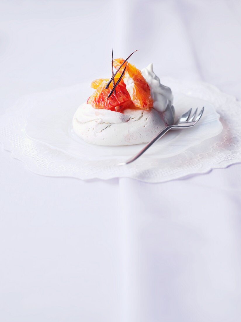 Pavlova with blood orange and a dollop of cream