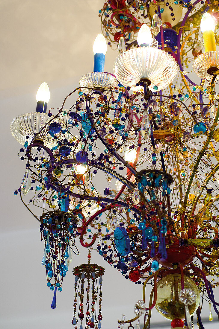 Chandelier decorated with blue glass beads
