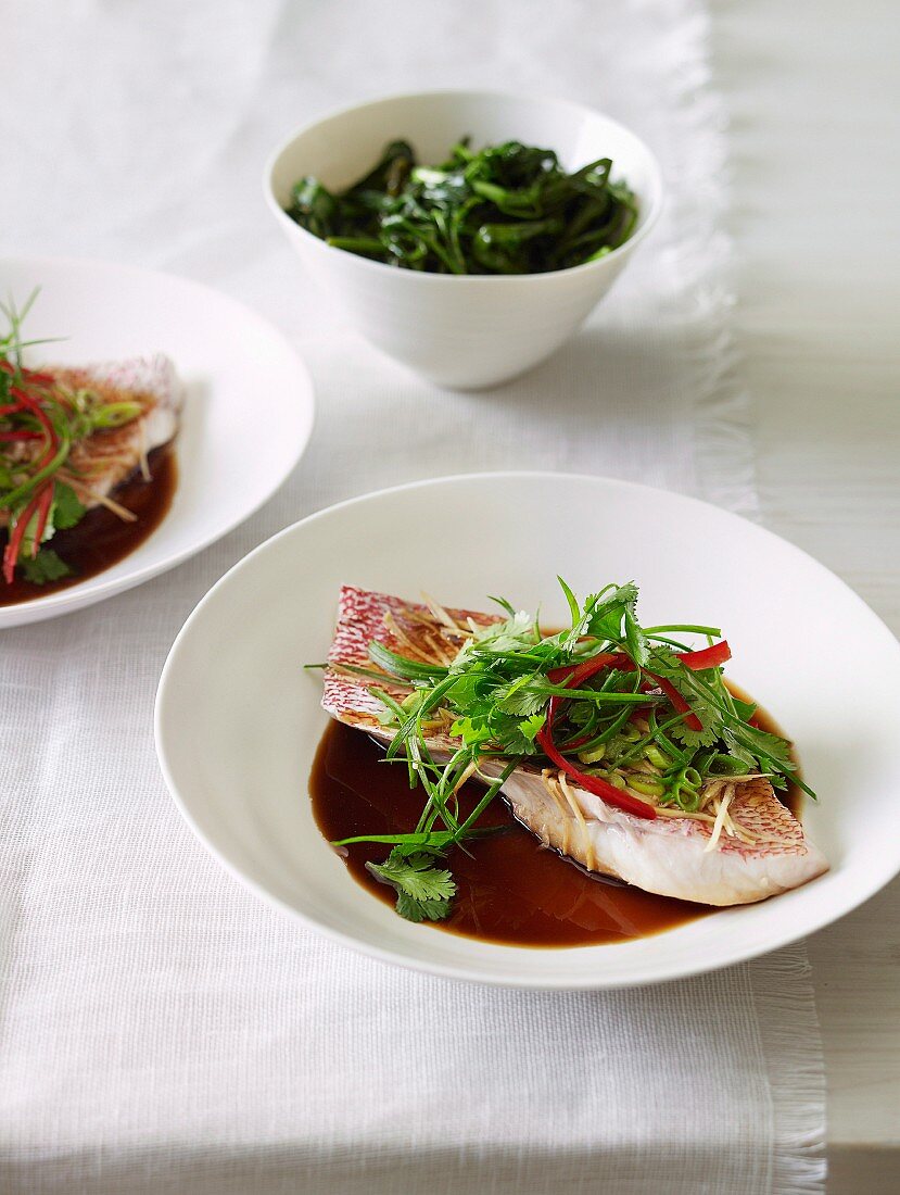 Steamed red snapper with ginger, spring onions and soy sauce