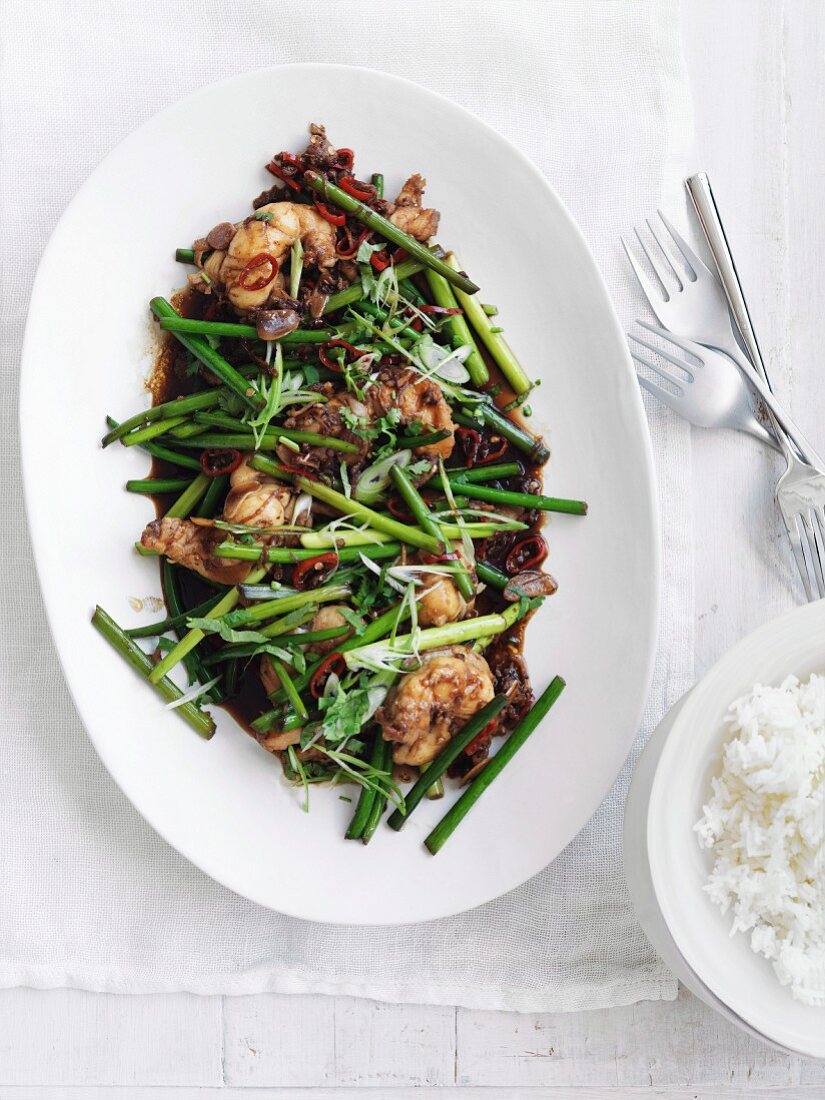 Fried lobster tails with Szechuan pepper and garlic shoots