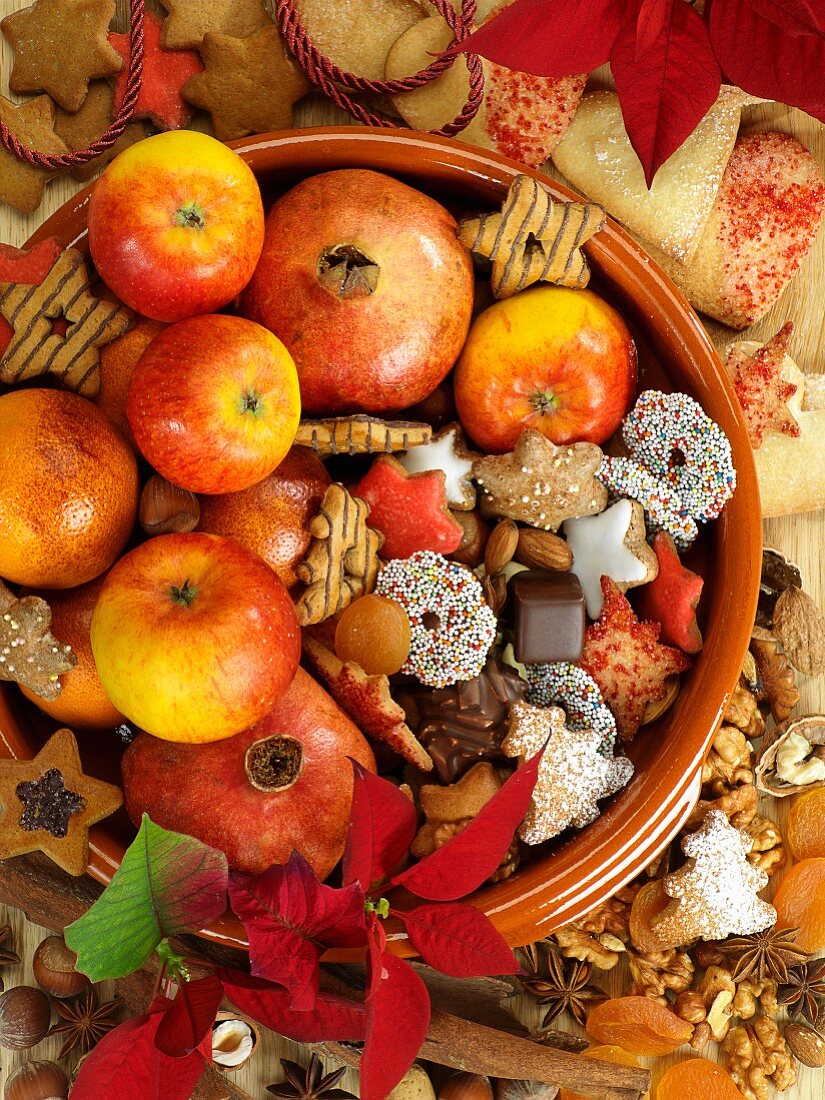 A Christmas arrangement of biscuits and fruit