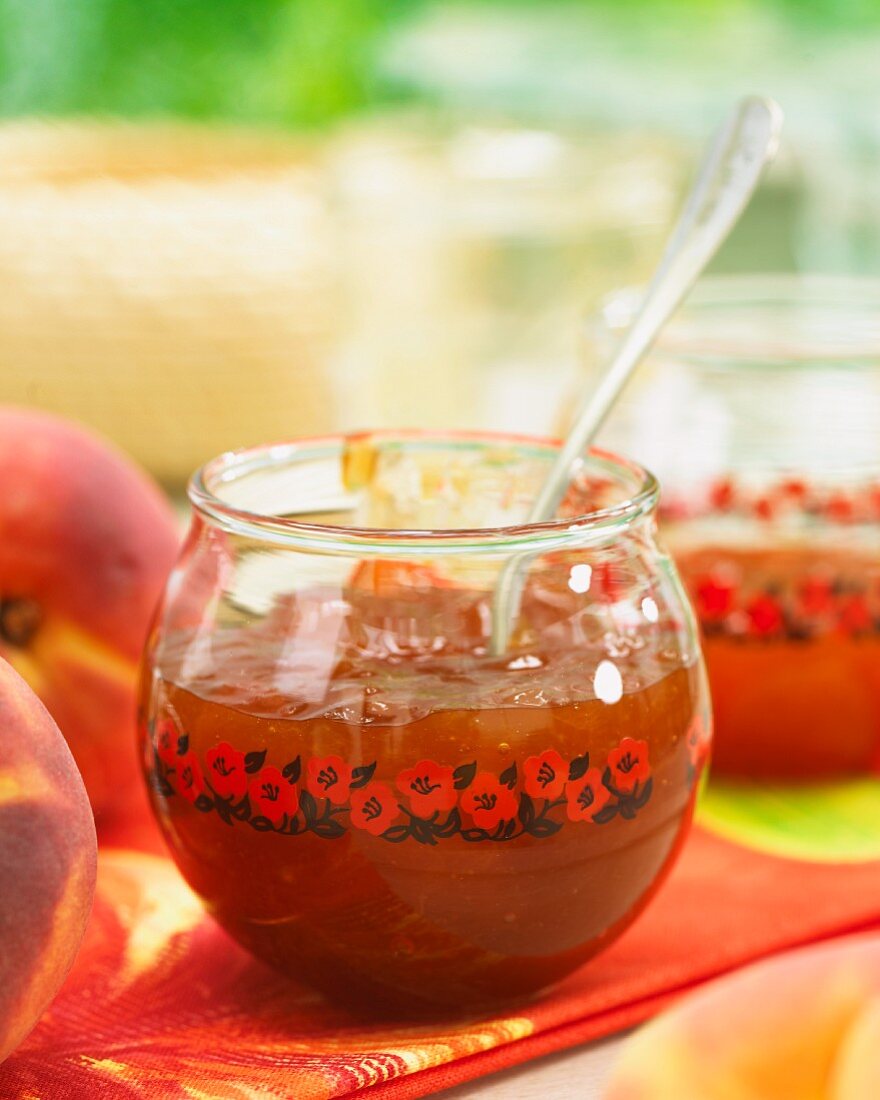 Peach jam in a glass bowl