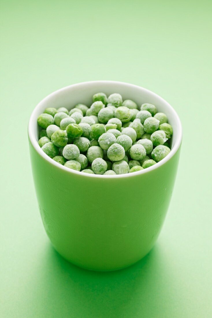 Frozen peas in a green cup