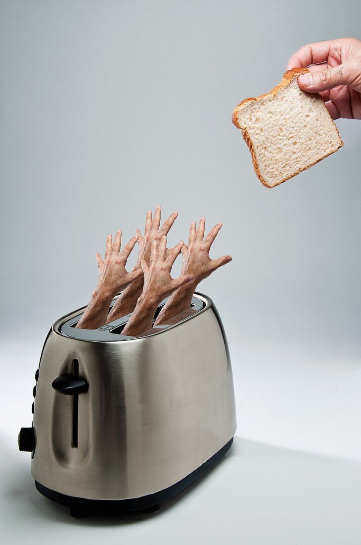 Four Hands Reaching From a Toasted to Grab a slice of Bread
