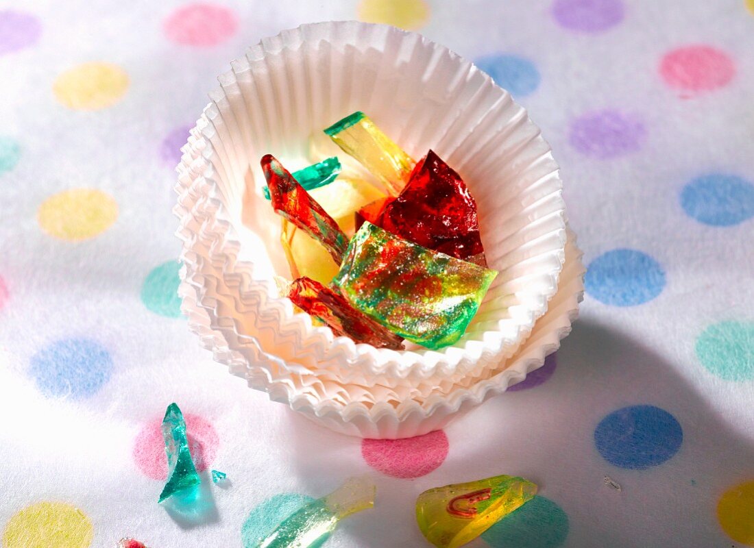 Coloured sweets in a stack of paper cases