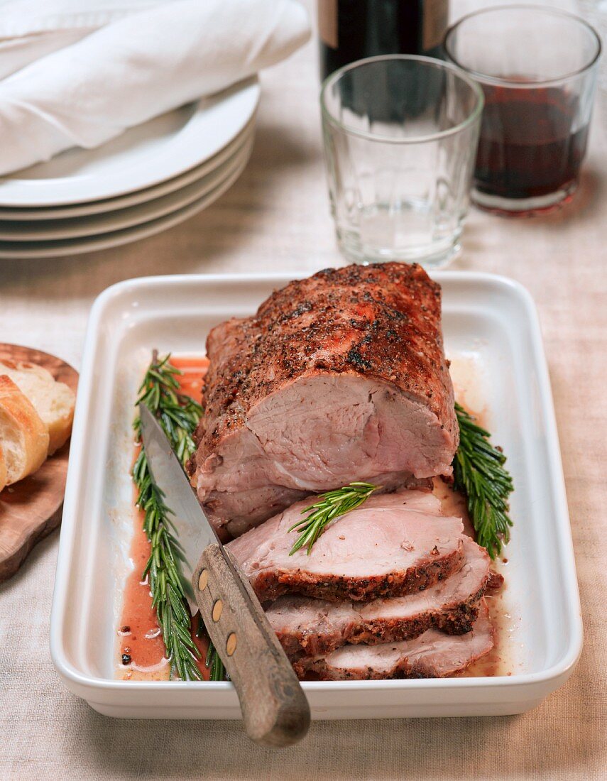 Sliced roast pork with rosemary