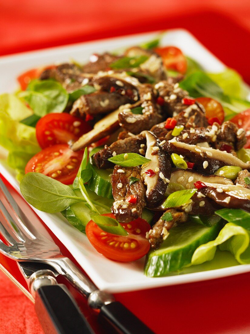 Beef with mushrooms, cucumber and tomatoes (Vietnam)