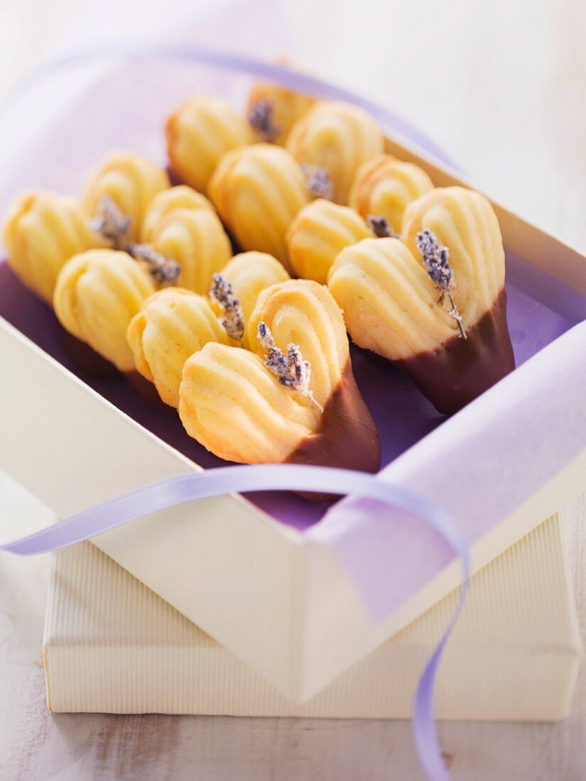 Heart-shaped biscuits decorated with lavender flowers and chocolate glaze