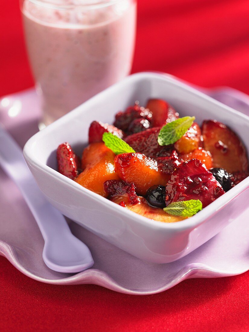 Baked summer fruits with a berry smoothie