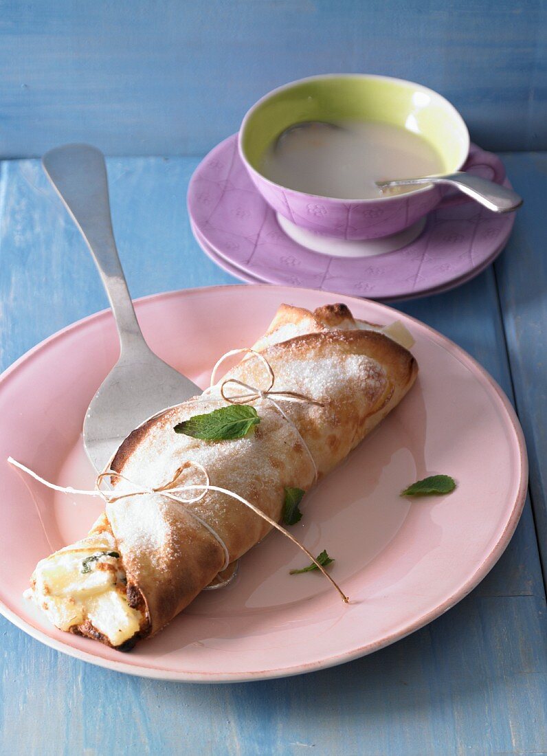 A pancake au gratin filled with pineapple and mint