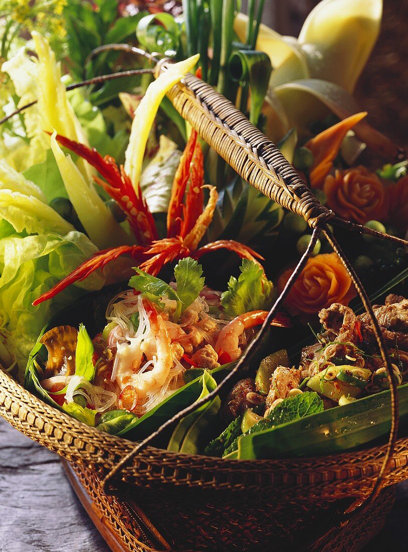 Two Assorted Salads in Leaf Bowls in a Basket