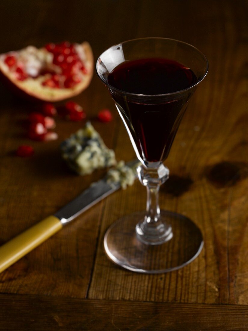 A glass of port wine, Stilton cheese and pomegranate