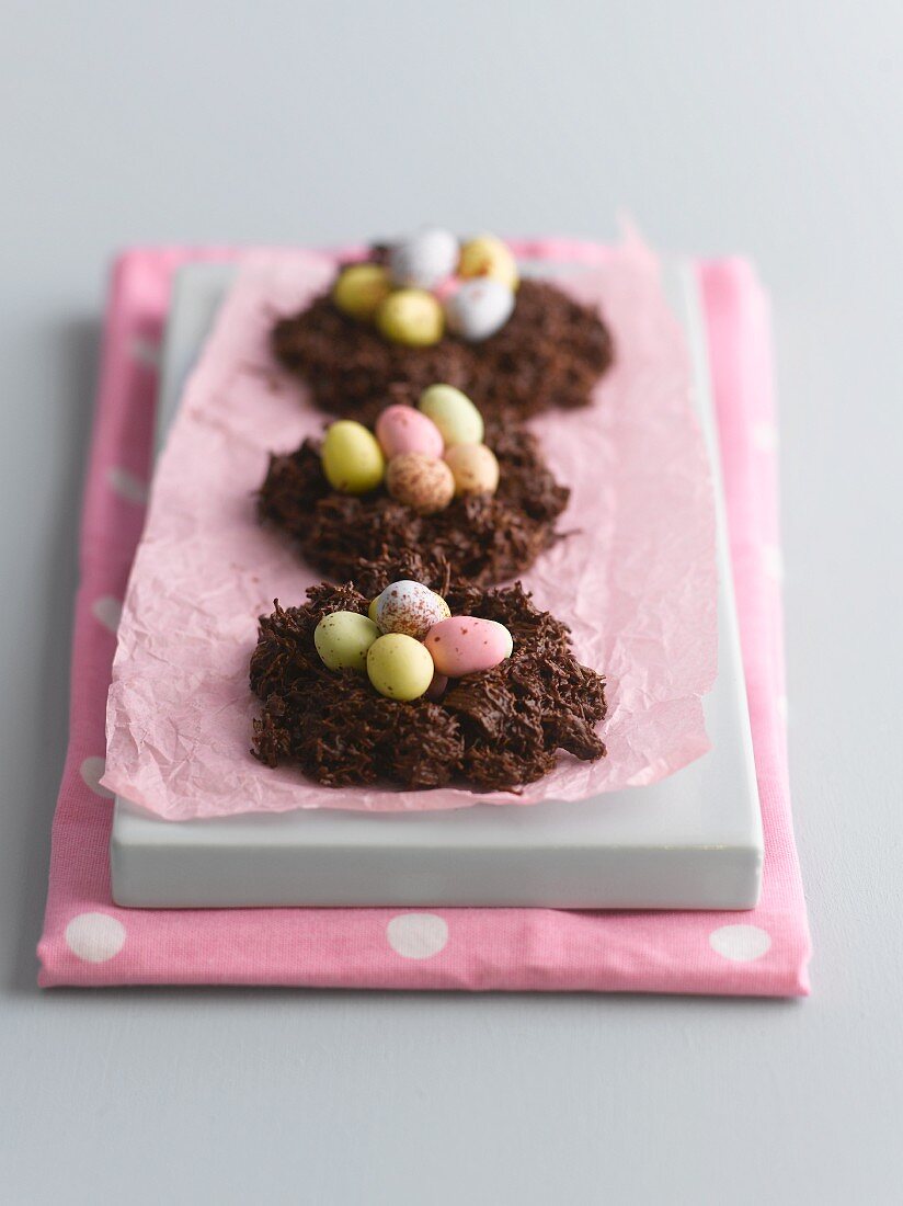 Chocolate cakes decorated with sugared eggs