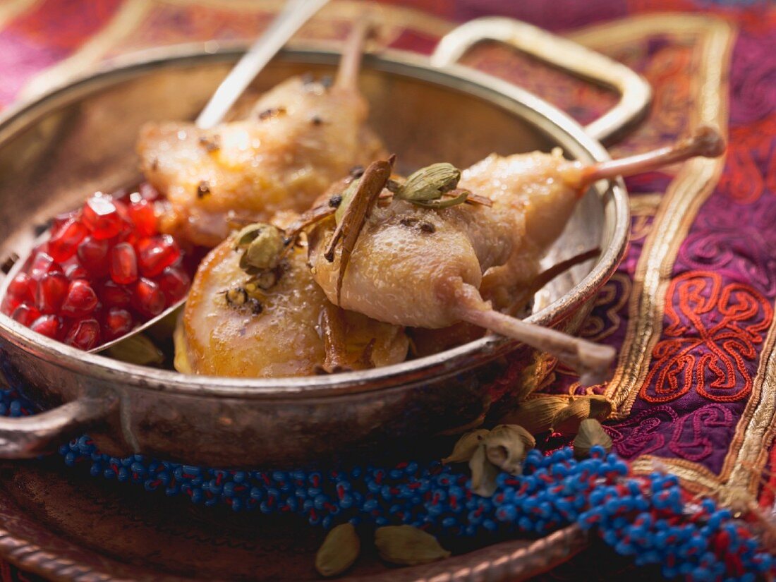 Roasted quail with pomegranate seeds