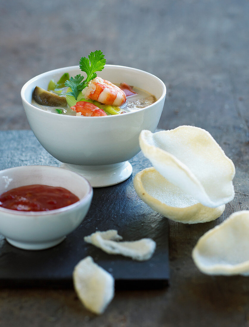 Asian soup with prawns, a dip and prawn crackers
