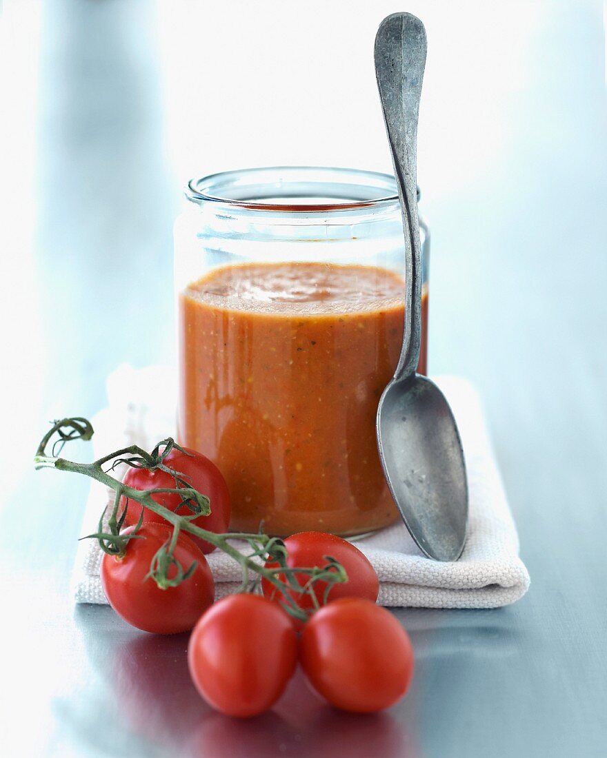 Tomato soup in a jar with fresh plum tomatoes