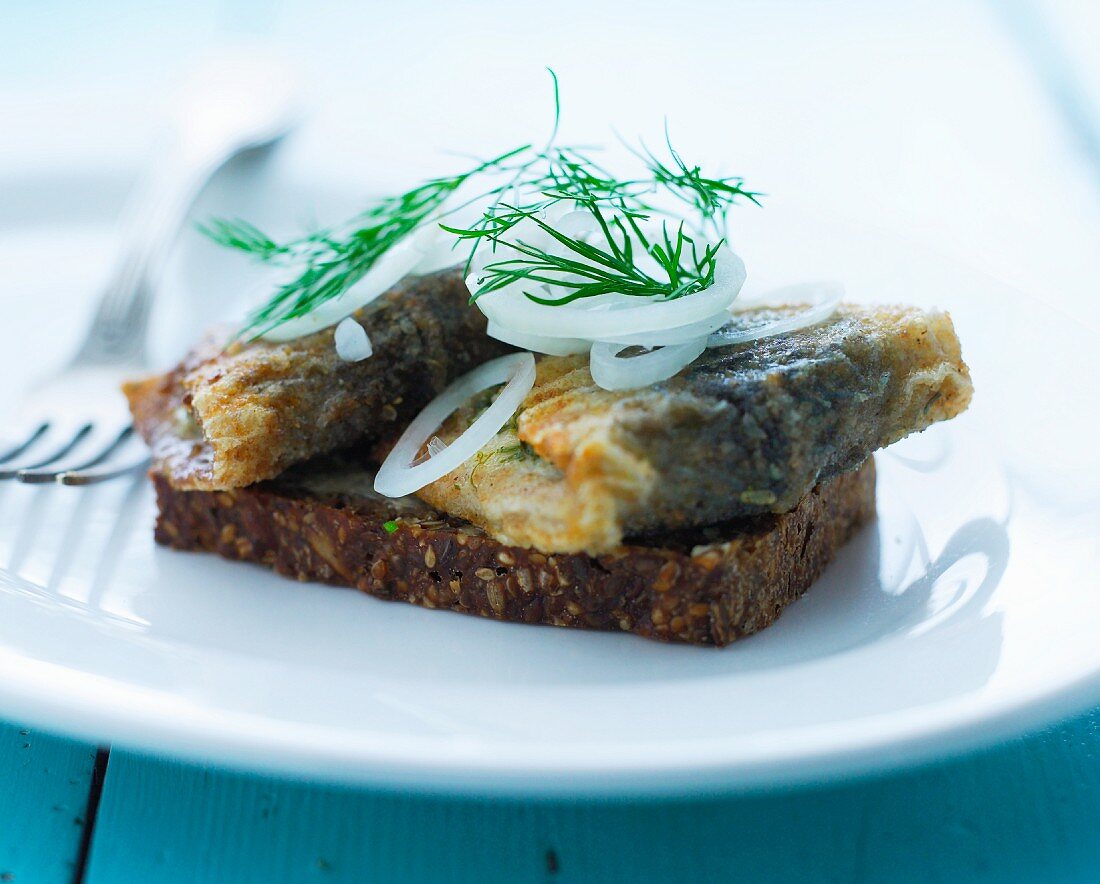 Smörrebröd topped with fried herring (Denmark)