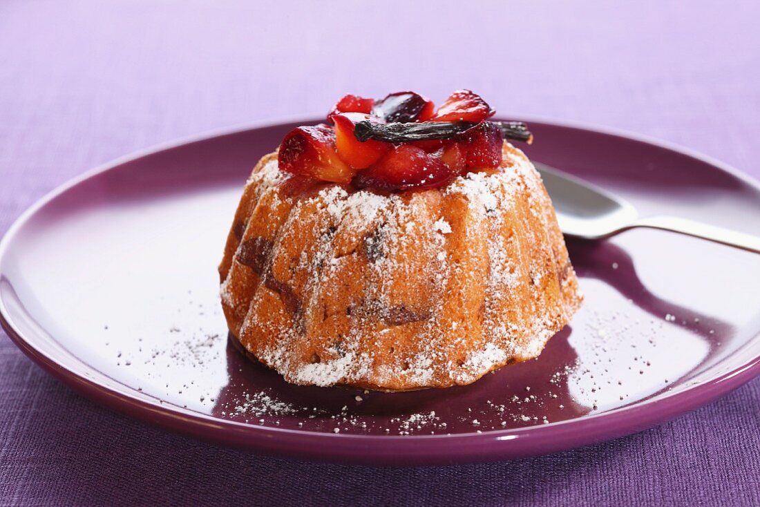 A mini Bundt cake topped with strawberries