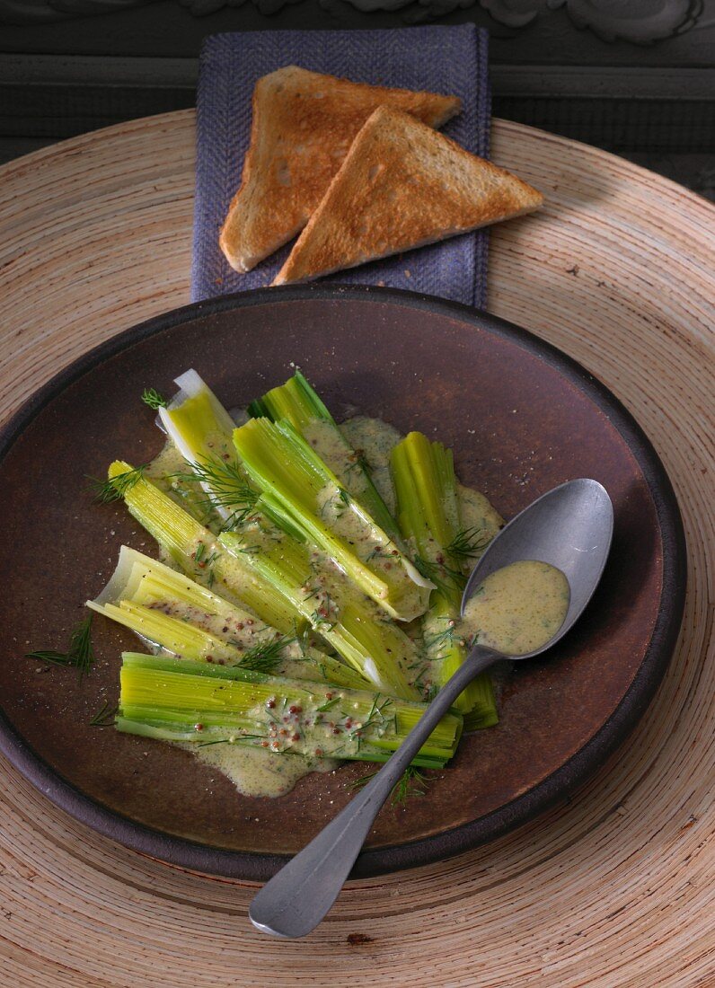 Warm marinated leek with a mustard and dill vinaigrette