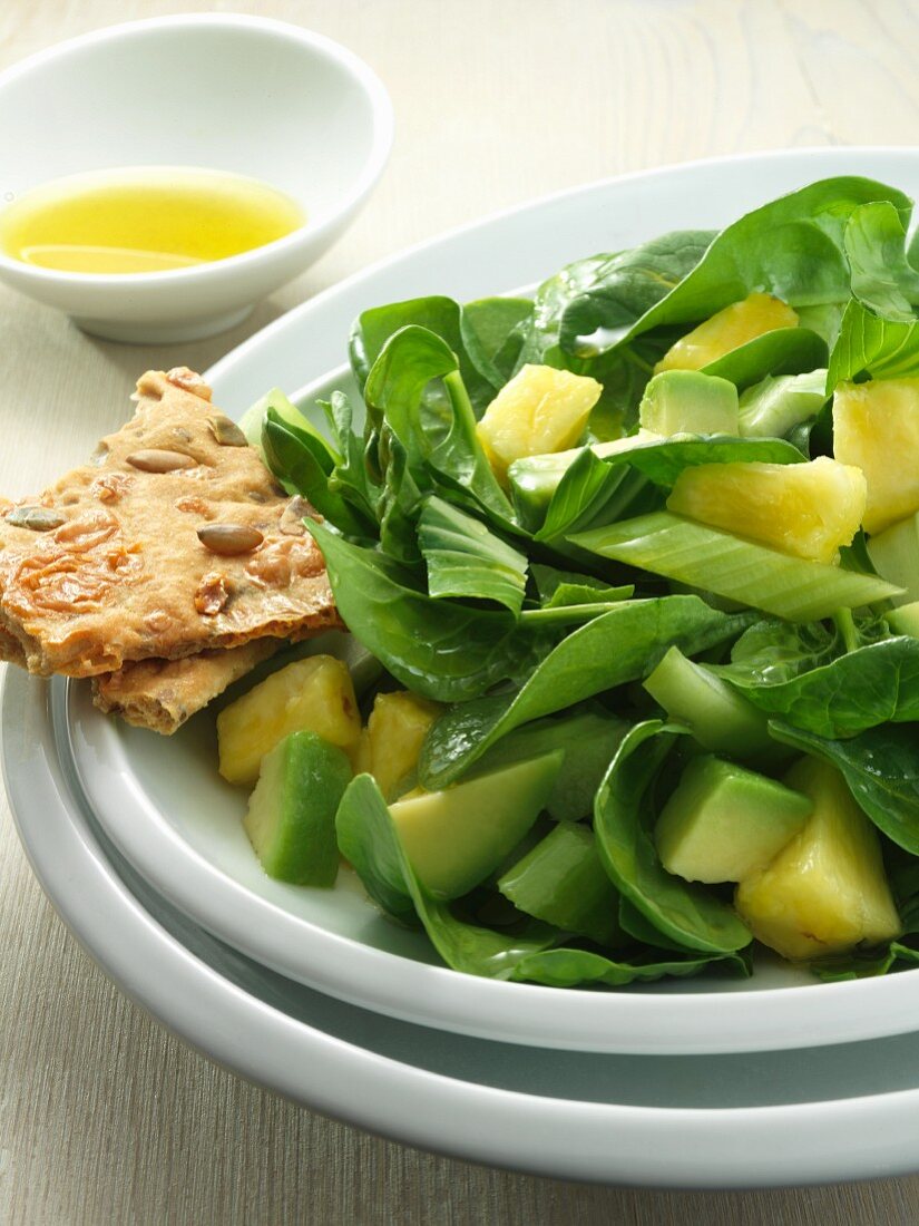 Spinach Salad with Pineapple and Avocado; Bowl of Dressing