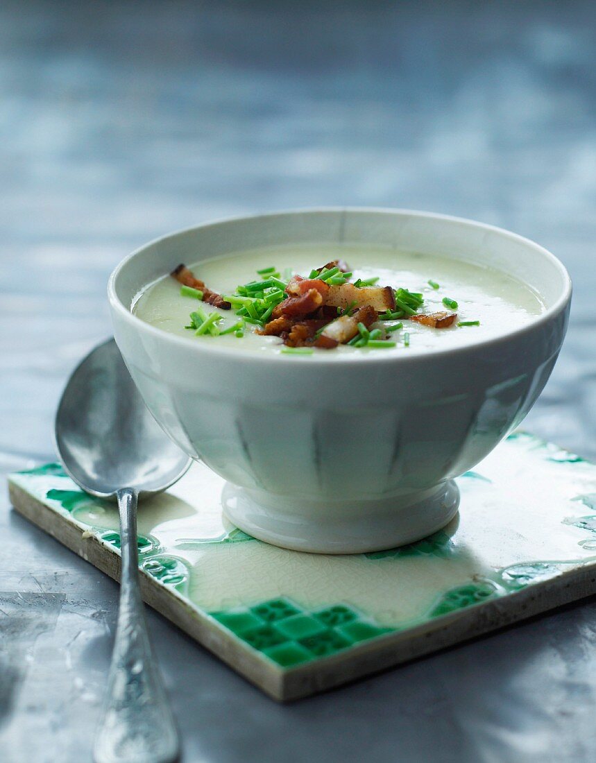 Cream of vegetable soup with bacon and chives