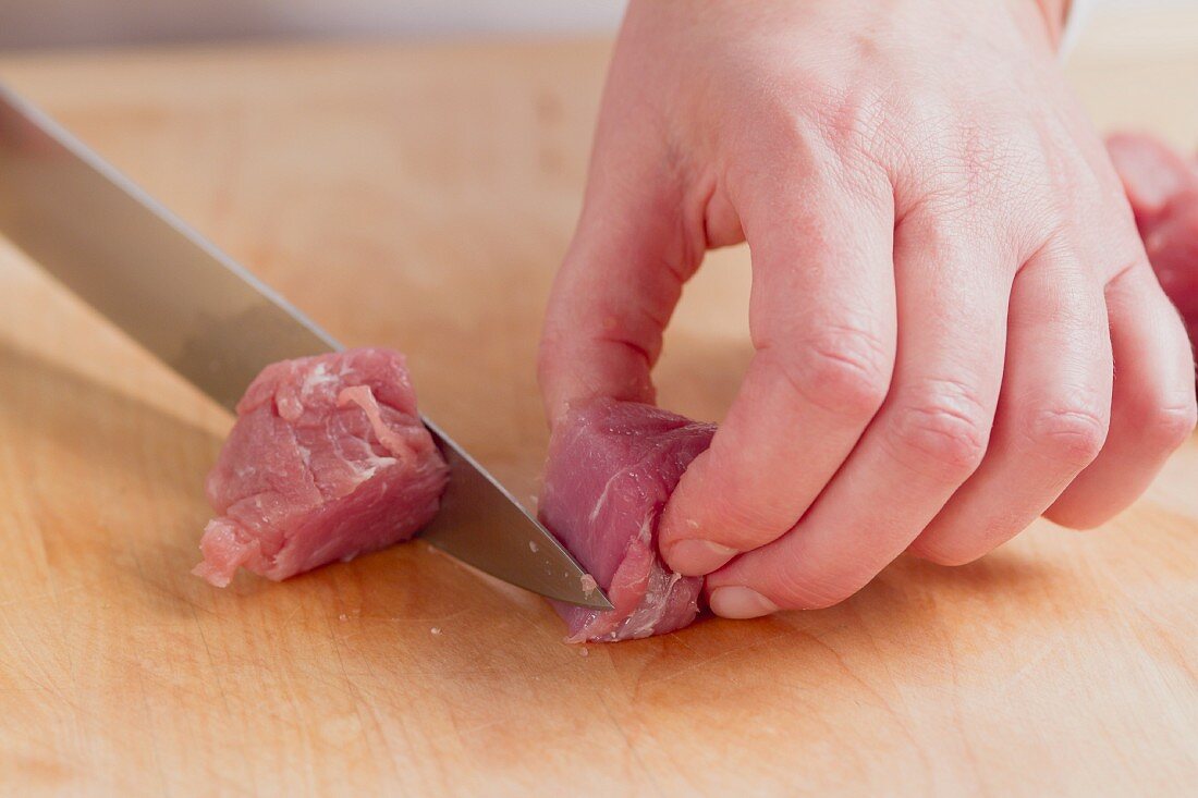 Meat being diced