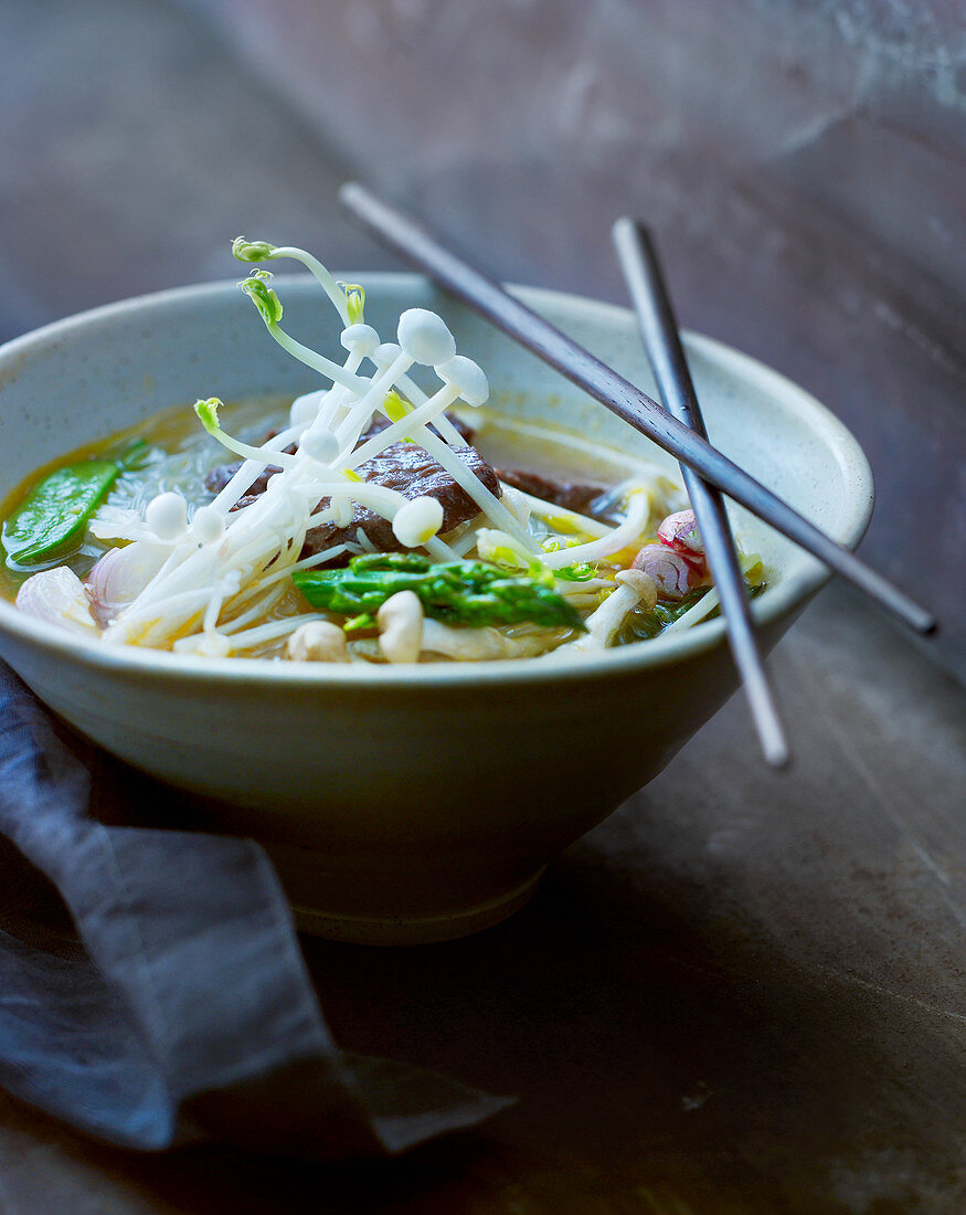 Asian vegetables soup with enokitake mushrooms