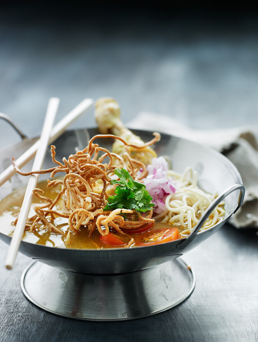 Asian chicken curry with fried noodles