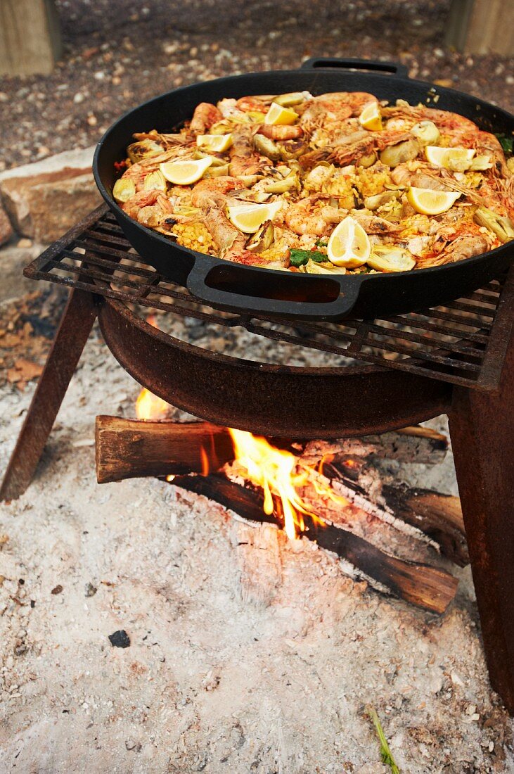 Paella Cooking Outside Over an Open Fire