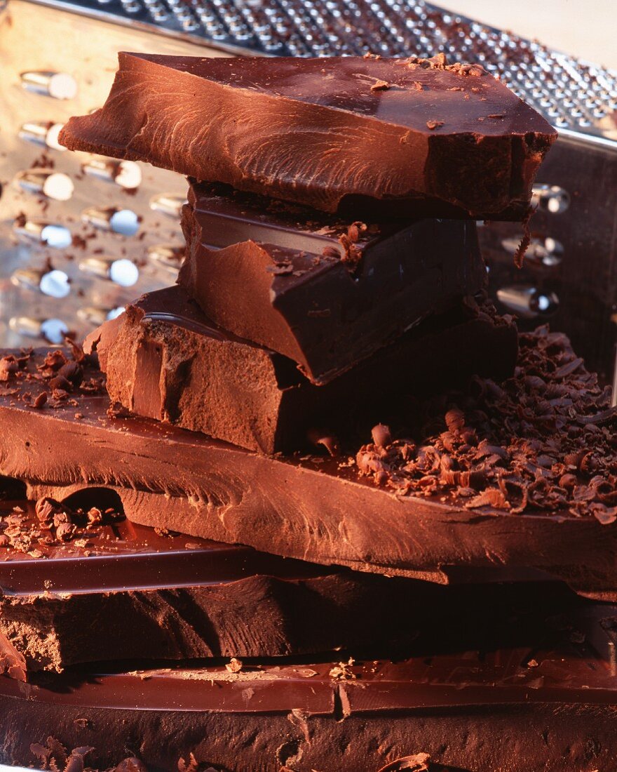 A stack of chocolate with a grater