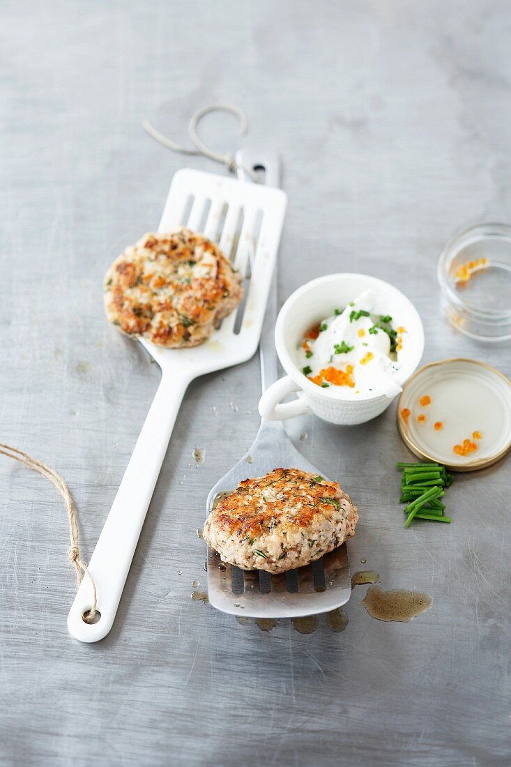 Fish burgers with chive and caviar sour cream