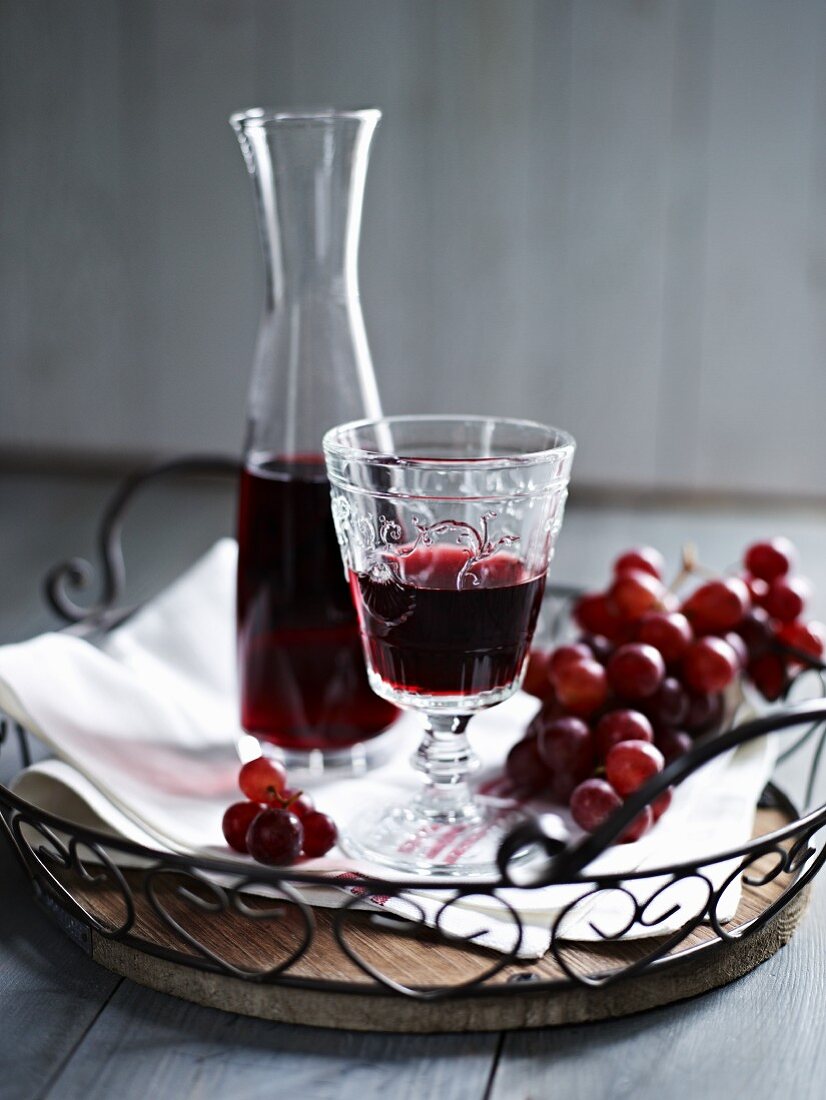 Red wine and red grapes