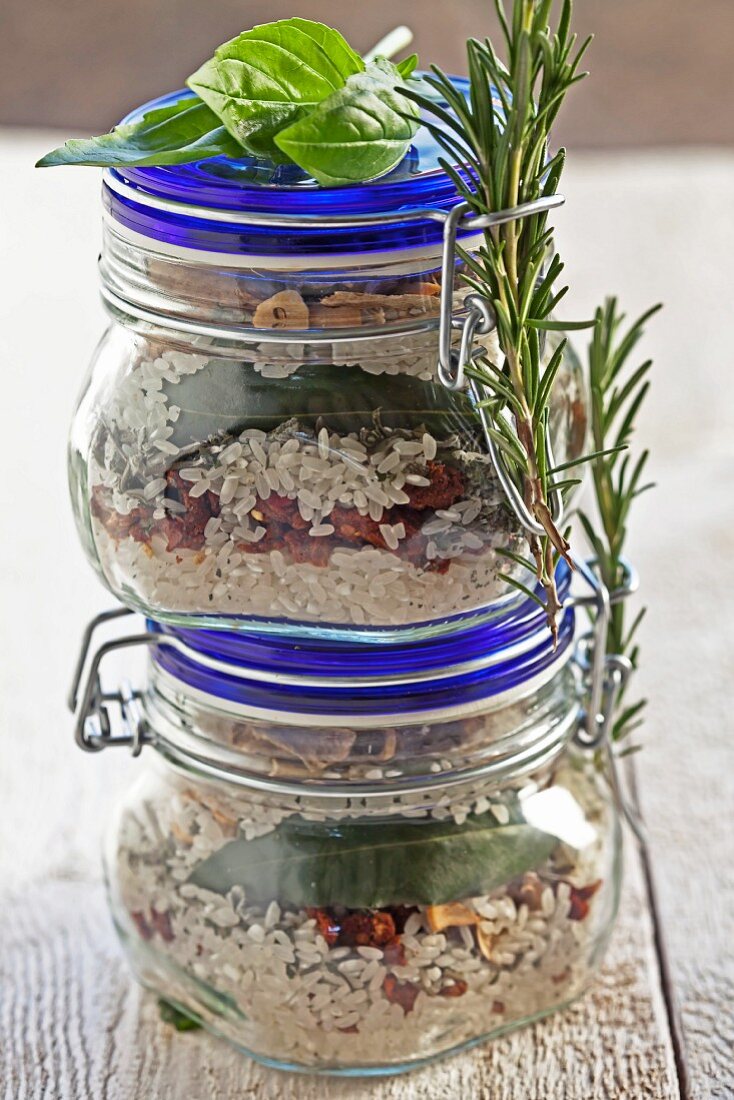 A mixture of dried ingredients for risotto in glasses as a gift