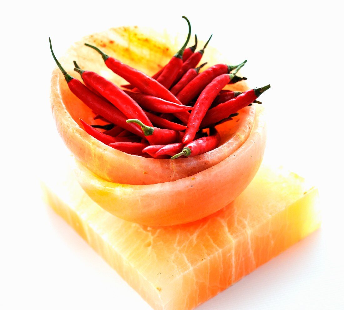 Fresh chilli peppers in a salt stone bowl