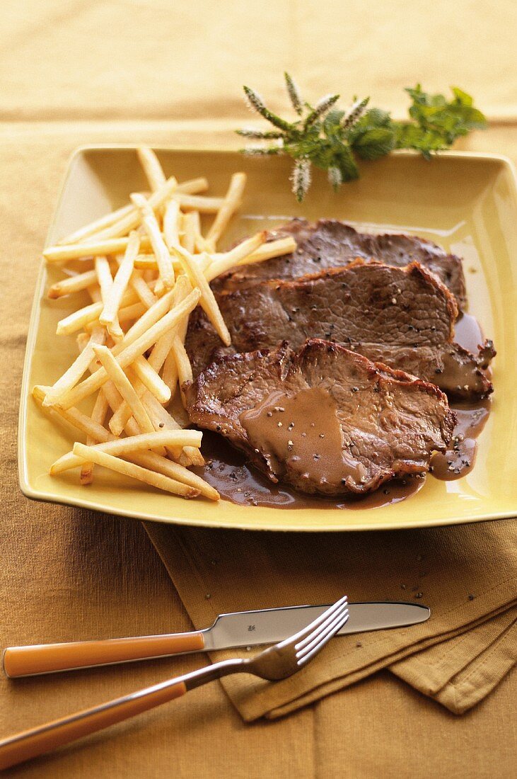 Beef steak with pepper sauce and chips